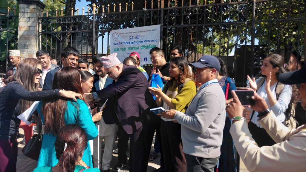 President of Nepal Association of the Blind together with chief guests and co-organizers distributing medal to female winner of the walkathon competition